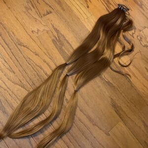 Ponytail hair extensions.  32 inch light auburn ponytail 3 strands for braiding